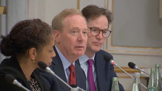 Microsoft’s Brad Smith (center), OpenAI’s Anna Makanju (left), and Meta’s Nick Clegg (right) at a press conference at the Munich Security Conference on February 16, 2024.