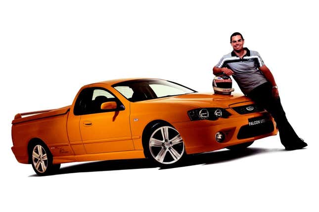 A yellow Falcon Ute with a guy leaning on the hood