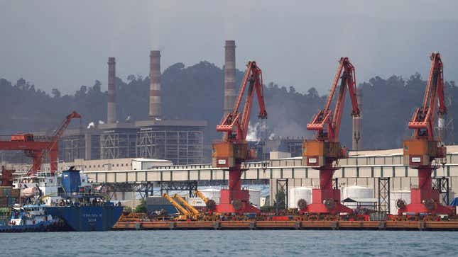 Loading cranes at a port at the Indonesia Morowali Industrial Park, operated by Nickel Mines Ltd., in Morowali Regency, Central Sulawesi, Indonesia, on Thursday, March 17, 2022. Indonesia, the worlds top nickel producer, will raise production capacity of the metal after prices soared past $100,000 a ton, while the coal market is unlikely to get similar relief. 