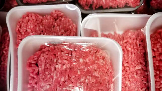 A variety of packages of ground beef at the supermarket. 