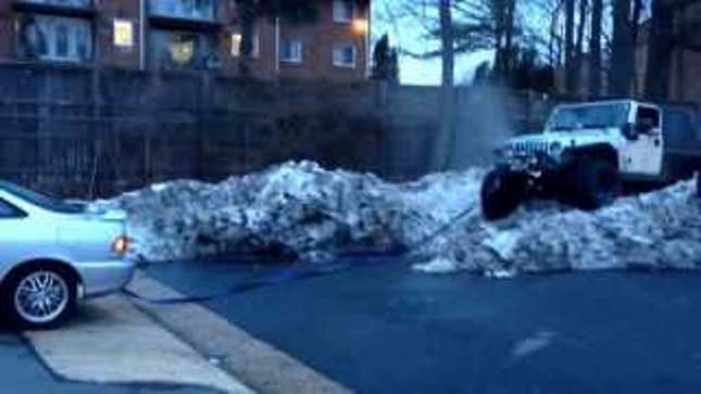 Puny Compact Car Rescues Stuck Jeep Wrangler