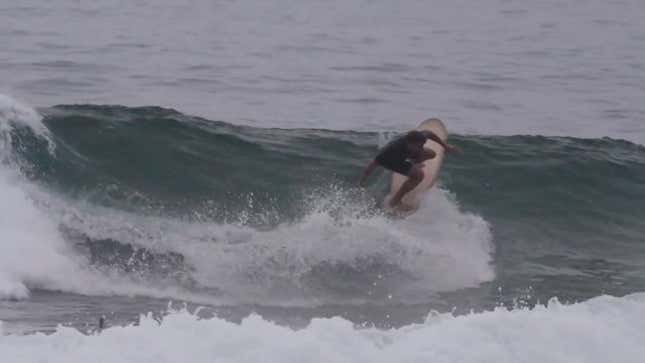 Surfer Gets Radical On Giant Dick Surfboard