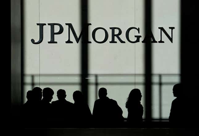 FILE - The JPMorgan Chase &amp; Co. logo is seen at the company&#39;s headquarters, Oct. 21, 2013, in New York. JPMorgan is facing nearly $350 million in fines from bank regulators due to issues with its trade surveillance program. (AP Photo/Seth Wenig, File)