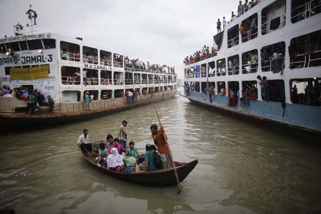 People are rowed to an overcrowded passenger boat at Sadarghat boat terminal in Dhaka.