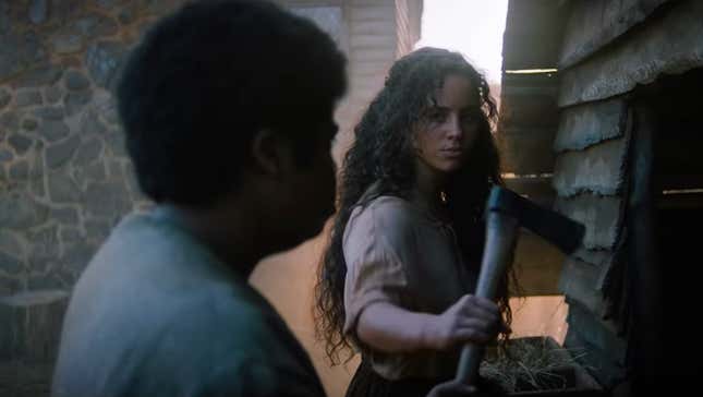 Fear Street's Kiana Madeira holds an ax as Deena Johnson while recalling the life of Sarah Fier in 1666.