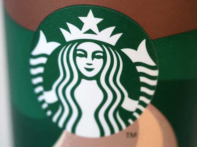 A Starbucks logo on paper cup.