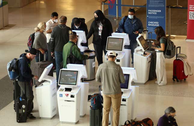 Delta Airlines customers check in for flights at San Francisco International Airport on May 12, 2022 in San Francisco. According to a report by the Bureau of Labor Statistics, airline fares surged 18.6% in April as demand for air travel has increased due to COVID-19-related travel restrictions being eased.