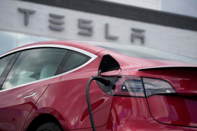 FILE - A 2021 Model 3 sedan charges at a Tesla dealership in Littleton, Colo., on June 27, 2021. Tesla&#39;s recall of over 2 million vehicles aimed at getting drivers using Autopilot to pay attention to the road relies on a software update that multiple studies show will not work. (AP Photo/David Zalubowski, File)