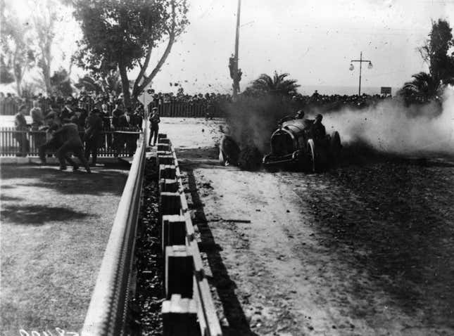 Spectators run for cover as Pullen, driving a Mercer, loses a wheel at 'death curve' during the Vanderbilt Cup Race at Santa Monica.