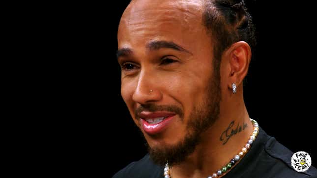 Image for article titled Lewis Hamilton Reveals He Nearly Drowned While Surfing And Refuses To Pee In The Car On 'Hot Ones'