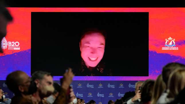 An image of Elon Musk looking red with a black background is shown.