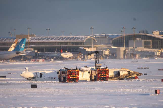 Image for article titled A Delta plane crashed and flipped upside down in Toronto. Here&#39;s what to know