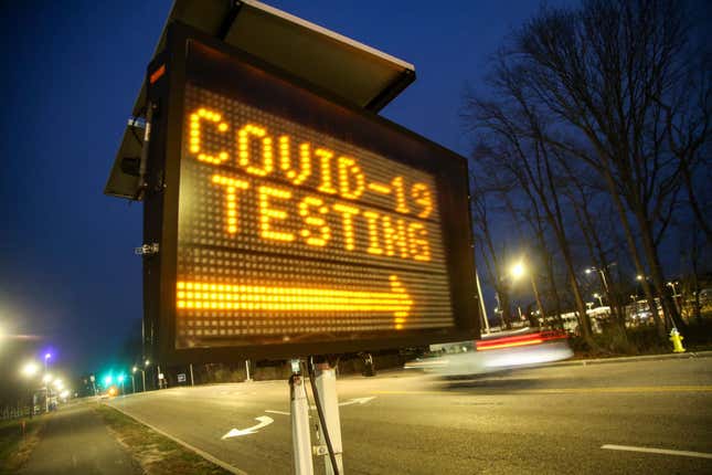 A digital sign directs people to the drive-through coronavirus testing area, which began on the main campus of Stony Brook University on March 18, 2020.