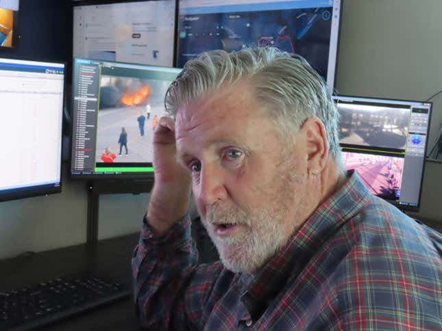 Bill McMenamin, a retired Atlantic City, N.J. police captain, monitors video screens in the department&#39;s surveillance center, where he currently works, on Nov. 16, 2023. The city is adding hundreds of security cameras to the 3,000 already keeping an eye on it. (AP Photo/Wayne Parry)