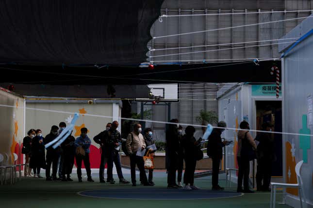 People queue at a community vaccination centre in Hong Kong, January 2023.