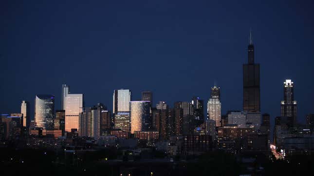 A photo of the Chicago skyline taken at night. 