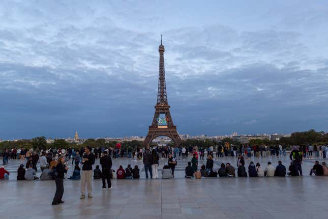 Tourists at Eiffel Tower in Paris, France.