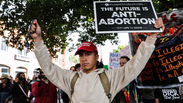 Anti-abortion rights demonstrators protest during a Women's March in Washington, DC, US, on Saturday, Oct. 8, 2022. On October 8th, exactly one month before Election Day, women and their allies marched across the country for a massive nationwide "Women's Wave" day of action meant to rally supporters of reproductive rights ahead of the 2022 midterms. Photographer: Valerie Plesch/Bloomberg via Getty Images