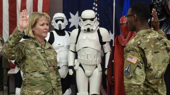 Maj. Gen. DeAnna Burt, Combined Force Space Component Command commander, is sworn in to the U.S. Space Force by Second Lt. Wellington Brookins, a U.S. Space Force officer assigned to the 533rd Training Squadron, during an International Space Day celebration May 7, 2021, Vandenberg Air Force Base, Calif. The lunchtime event for CSpOC and Combined Force Space Component Command (CFSCC) personnel included opening remarks from CSpOC/Space Delta 5 commander Col. Monique DeLauter, a rocket design and launch competition, and a cornhole tournament, followed by a brief transfer-of-service ceremony for the CFSCC commander Maj. Gen. DeAnna Burt.