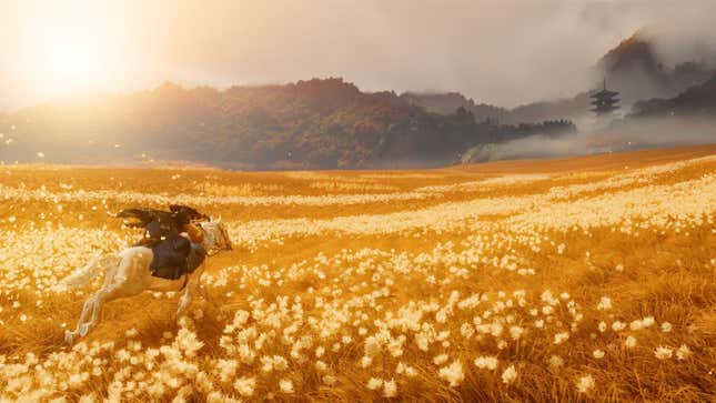 Atsu rides through a field on horseback.