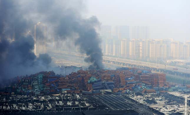 Smoke rises from shipping containers after the explosions.