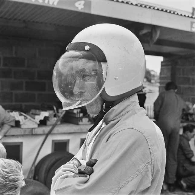 Richie Ginther shows off a new style of visor at the 1964 British Grand Prix.