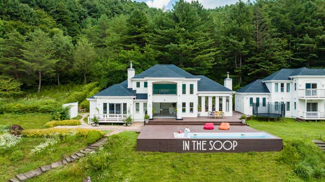 A photo of the countryside property that hosted BTS for the reality show IN THE SOOP is shown.