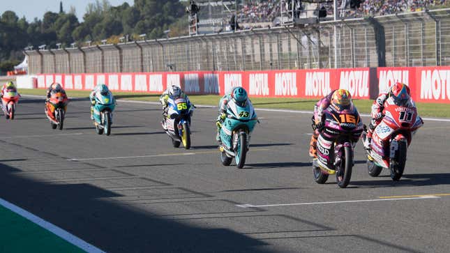 A photo of motorbikes on the starting grid in Valencia. 