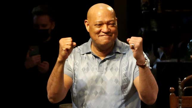 Actor Laurence Fishburne raises his fists in a seemingly congratulatory gesture during American Buffalo's opening night in the Square Theatre in April 2022.  