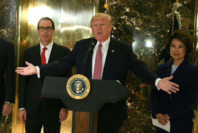 US President Donald Trump speaks to the press about protests in Charlottesville after his statement on the infrastructure discussion in the lobby at Trump Tower in New York on August 15, 2017.