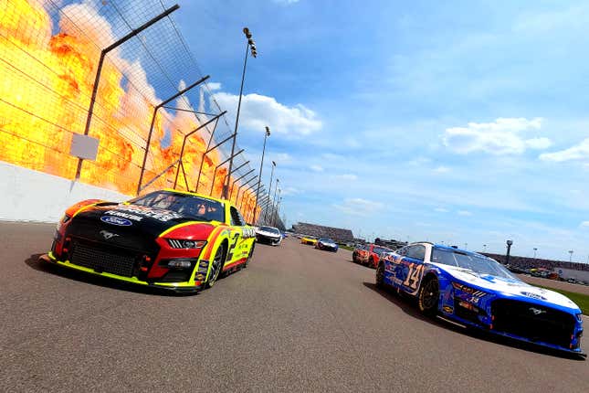 Austin Cindric, driver of the No. 2 Menards/Atlas Ford, and Chase Briscoe, driver of the No. 14 HighPoint.com Ford, lead the field on a pace lap prior to the NASCAR Cup Series Enjoy Illinois 300 at WWT Raceway on June 05, 2022 in Madison, Illinois. 