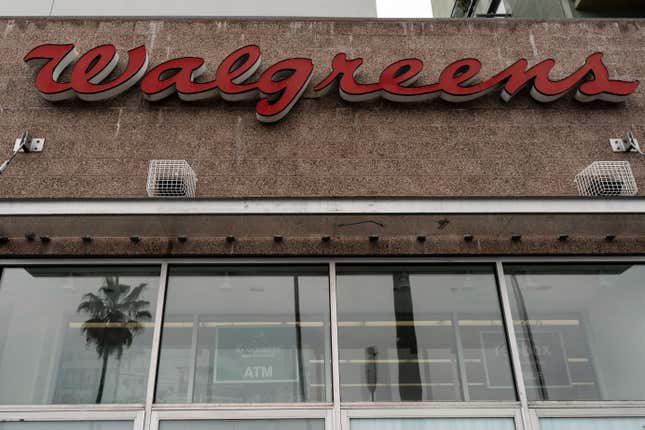 A palm tree is reflected in the window of a Walgreens pharmacy in Los Angeles, Friday, March 10, 2023. Walgreens is chopping its dividend nearly in half as the drugstore chain looks to strengthen its balance sheet. The health care giant said Thursday, Jan. 4, 2024 that reducing its quarterly payout to shareholders to 25 cents per share will help free up capital to spend growing its pharmacy and health care businesses. (AP Photo/Jae C. Hong)