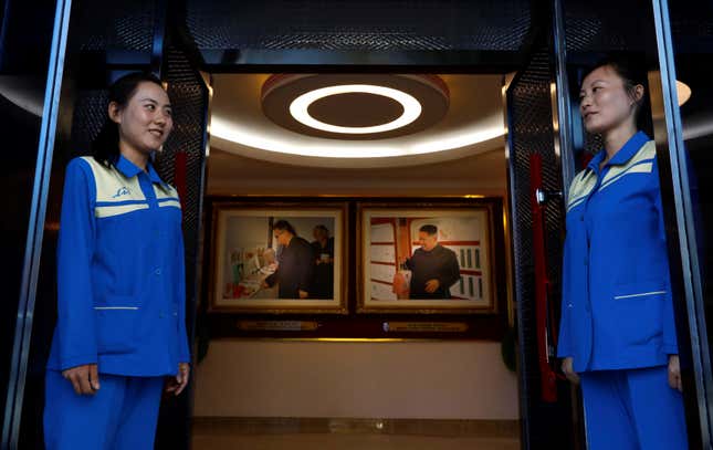 Two women at a cosmetics factory that foreign reporters stopped at during a government-organized visit.