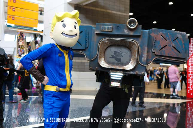 Vault Boy and Securitron stand together. 