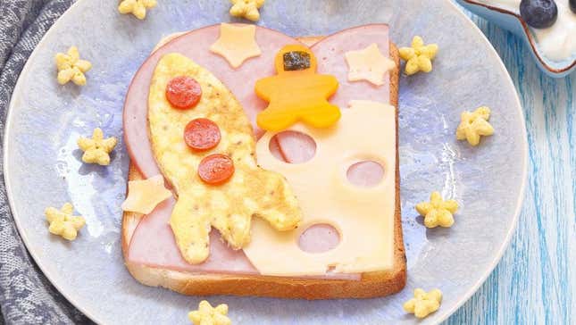 Sandwich with rocket ship made of egg and astronaut made of sweet potato