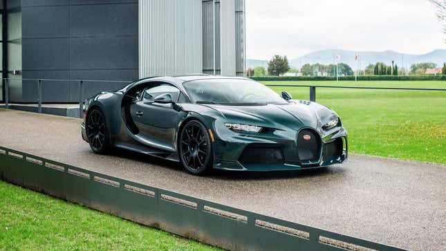 A dark green Bugatti Chiron Super Sport at a company facility.