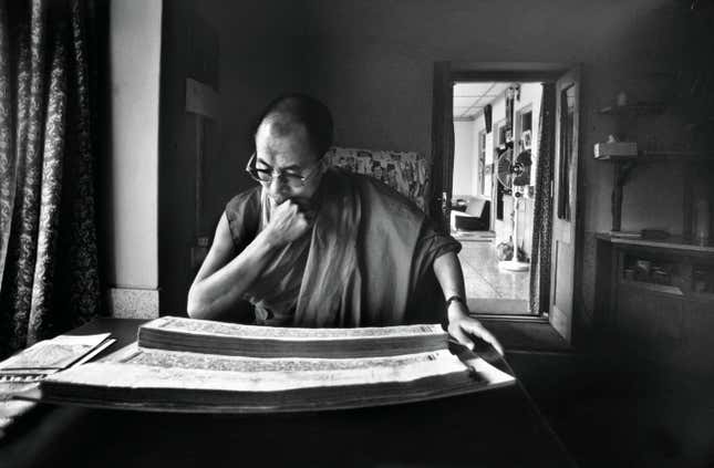 The leader’s morning routine often involves reading Tibetan scriptures.