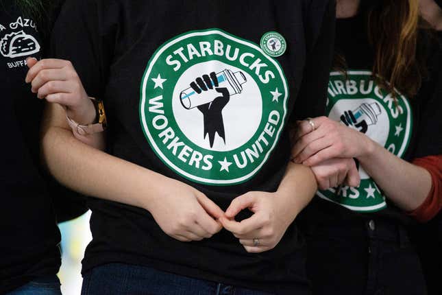 FILE - Starbucks employees and supporters link arms during a union election watch party Dec. 9, 2021, in Buffalo, N.Y. Starbucks and the union organizing its U.S. workers said Tuesday, Feb. 27, 2024, they have agreed to begin talks with the aim of reaching labor agreements. (AP Photo/Joshua Bessex, File)