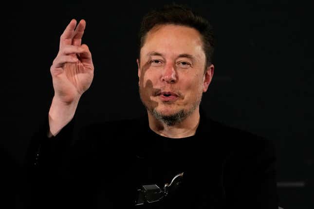 File - Elon Musk, owner of social media platform X, gestures during an event with Britain&#39;s Prime Minister Rishi Sunak in London on Nov. 2, 2023. IBM has stopped advertising on X after a report said its ads were appearing alongside material praising Adolf Hitler and Nazis. (AP Photo/Kirsty Wigglesworth, Pool, File)