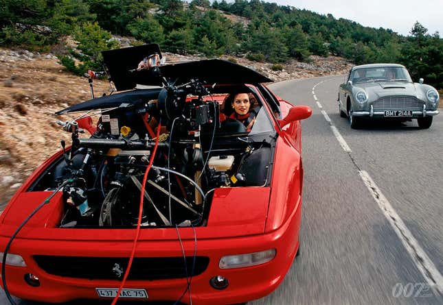 Famke Janssen in a red Ferrari F355 film car