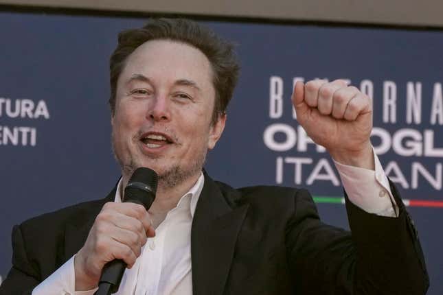 File - Tesla CEO Elon Musk waves as he arrives at the annual political festival Atreju, organized by the Giorgia Meloni&#39;s Brothers of Italy political party, in Rome, Dec. 16, 2023. A judge says Elon Musk must give up a compensation package awarded by Tesla&#39;s board of directors that is potentially worth more than $55 billion. (AP Photo/Alessandra Tarantino, File)