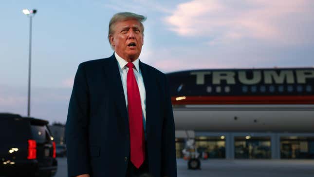  Former U.S. President Donald Trump speaks to the media at Atlanta Hartsfield-Jackson International Airport after surrendering at the Fulton County Jail on August 24, 2023 in Atlanta, Georgia.