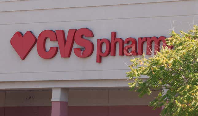 Close-up of red "CVS Pharmacy" sign on outside of a building