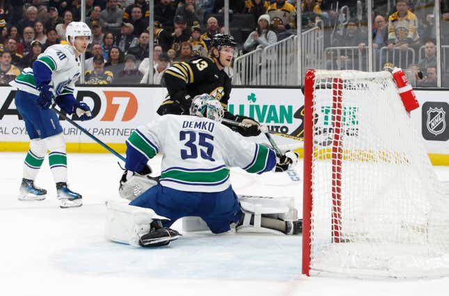 BOSTON, MASSACHUSETTS - FEBRUARY 08: Danton Heinen #43 of the Boston Bruins scores against Thatcher Demko #35 of the Vancouver Canucks during the first period at the TD Garden on February 8, 2024 in Boston, Massachusetts. (Photo by Rich Gagnon/Getty Images)