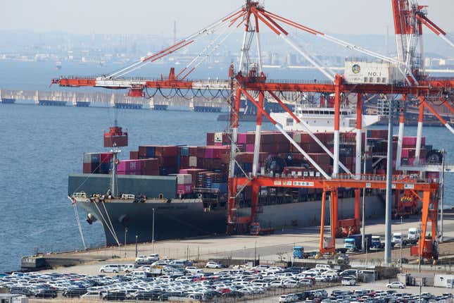 FILE - A container ship is loaded and unloaded at a container terminal at a port of Kawasaki near Tokyo on March 9, 2022. Japan’s exports fell 0.8% in August 2023 from a year earlier, with steep declines in shipments to China and the rest of Asia, its largest regional market. (AP Photo/Koji Sasahara, File)