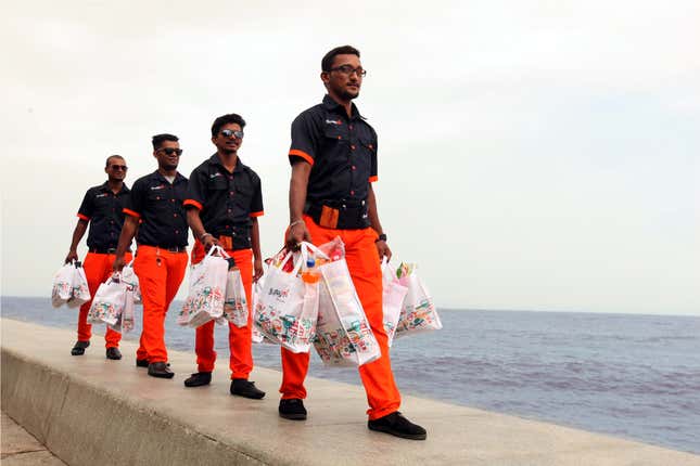 Uniformed delivery boys.