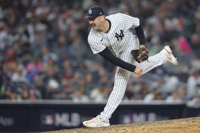 Oct 22, 2022; Bronx, New York, USA; New York Yankees relief pitcher Lou Trivino (56) pitches in the seventh inning against the Houston Astros during game three of the ALCS for the 2022 MLB Playoffs at Yankee Stadium.