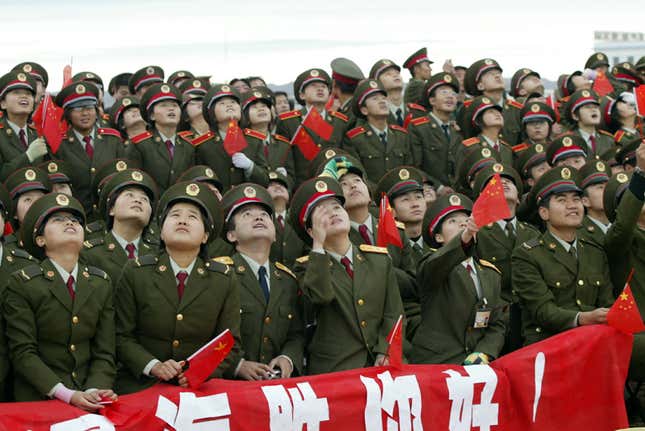 In 2005, scores of Chinese, including many soldiers, gathered to watch China’s second manned mission.