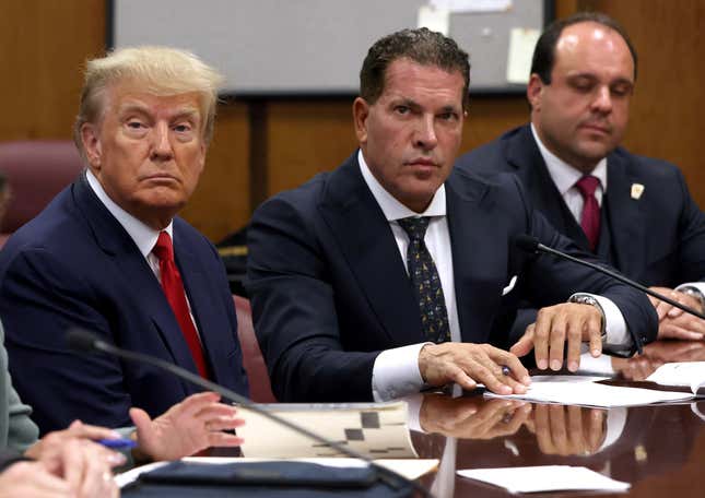 NEW YORK, NY - APRIL 04: Former U.S. President Donald Trump sits with his attorneys Joe Tacopina and Boris Epshteyn inside the courtroom during his arraignment at the Manhattan Criminal Court April 4, 2023 in New York City.