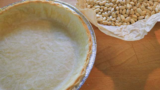 The crust should be lightly browned along the edge, and dry throughout the sides and center.